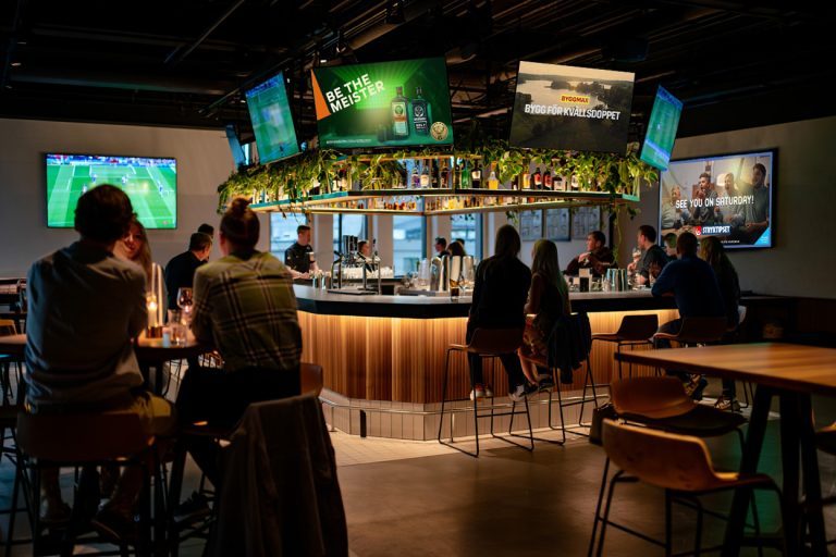A sports bar, screens above the counter